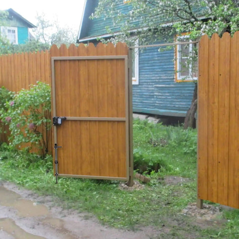 Heavy Duty Cane Bolt And 18 Inch Drop Rod Kit Built Like A Tank With Black Powder Coating For Outdoor Wood Fence Gates on a wooden gate.