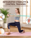 Integrated stability training session using a Reversible Half Moon Cork Yoga Block Pair Solid Game Changer Balance Trainer.