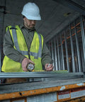 Construction worker using NGT 25 Foot Tape Measure With One And A Quarter Inch Tape For Quick Accurate Measurements Durable Locking Mechanism