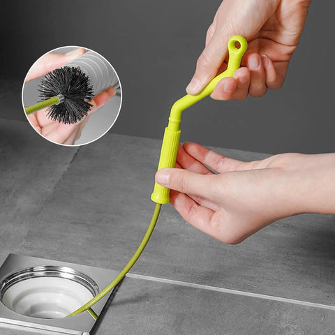 Flexible Drain Snake For Kitchen Sink And Bath Plumbing Portable Bendable Pipe Cleaner Spiral Design, hand holding pipe cleaner near sink.
