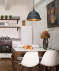 Kitchen with Bartlett Pendant Lights With Copper Patina Finish, industrial ceiling fixture above wooden dining table, apples on table