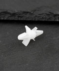 Top Shelf 100 Count White Pcb Standoff Mounting Clips Quick Snap Fit For 4Mm Holes on a dark surface showing detail and size.