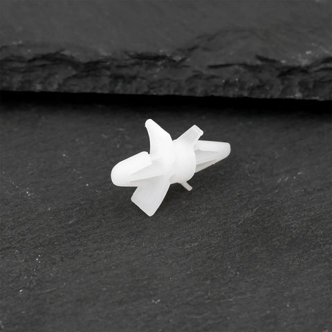 Top Shelf 100 Count White Pcb Standoff Mounting Clips Quick Snap Fit For 4Mm Holes on a dark surface showing detail and size.