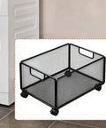Smooth Rolling Storage Cart With Heavy Duty Iron Construction And Open Shelves Ideal For Office Organization Kitchen Utility Or Art Supply Sorting. Black wire mesh cart with wheels.