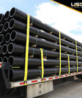 196 Pack 2 In X 50 Ft Ratchet Straps With Flat Hooks Heavy Duty Workhorse Polyester Webbing Tie Downs 10,000 Lbs Break Strength securing black pipes on flatbed trailer.