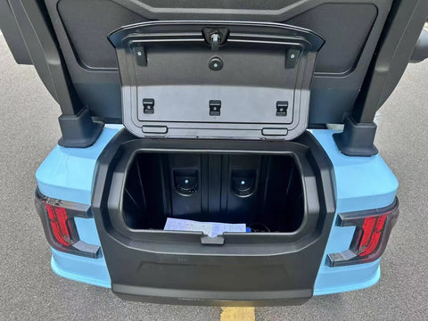 Slick Four Seater Electric Golf Cart Boasting Ridiculously Comfy Luxury Seats And Knobby Antislip Tires With A Sharp Hd Led Display For A Real Smooth Weekend Ride In Light Blue trunk view with storage space.