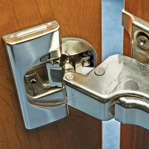 Close-up of Full Overlay Cabinet Hinges 110 Degree Soft Close BLUMOTION Clip Top Frameless Pair in durable steel on wood cabinet