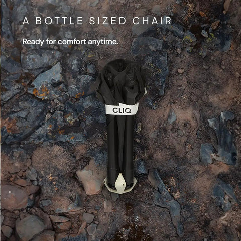 Go To Ultra Lightweight Camping Chair For Outdoors Easy Fold Portable Lawn Chair folded to bottle size on rocky ground