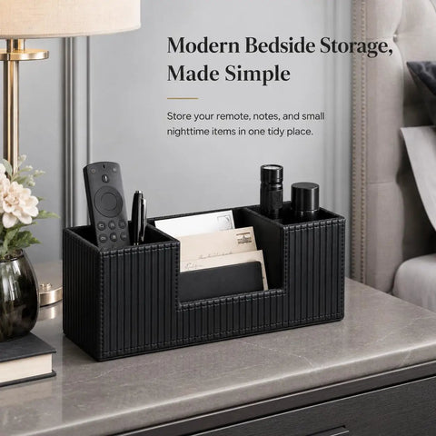 PU Leather Desk Organizer And Pen Holder For Office Black on bedside table with remote, notebooks, pens neatly sorted.