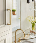 Cowrie Champagne Bronze Cabinet Pull Five And One Sixteenth Inch Center To Center Measurement for Cabinets and Drawers installed on cabinet