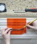 DIY Friendly No-Fuss All In One Cabinet Door And Drawer Drill Mounting Template For Precise Knob And Pull Installation shown in use.