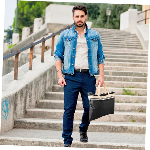 Man carrying a black All In One Art Storage Pouch With Zipper File Bag For Documents Artwork And Supplies For School Office And Travel