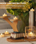Table setting with 100 Pack Flameless LED Tea Light Candles Bulk With Long Lasting Battery For Safe Realistic Flicker Ambience