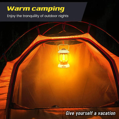 Led Camping Lantern With Rechargeable Battery And Retro Metal Construction illuminating an orange tent interior at night