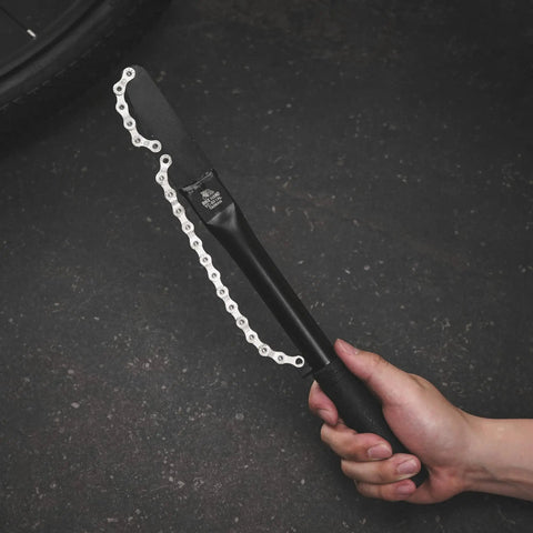 Person holding Pro Grade Cassette Removal Tool Kit for Shimano and Sram Freewheel Turner, Chain Whip, extra long handle