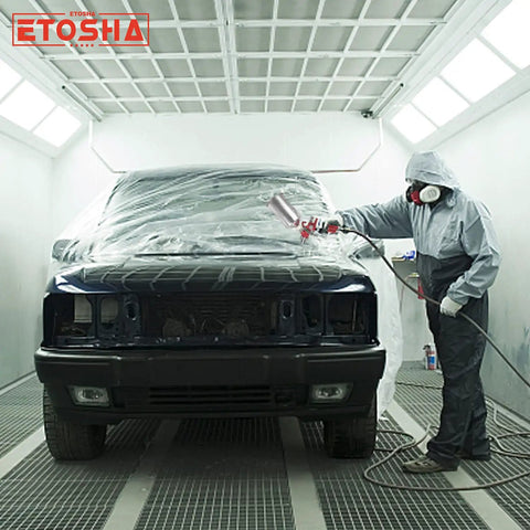 Person using HVLP Air Spray Gun Set For Pro Grade Finishes With Gravity Feed, 9 Piece Paint Sprayer Kit in a car spray booth