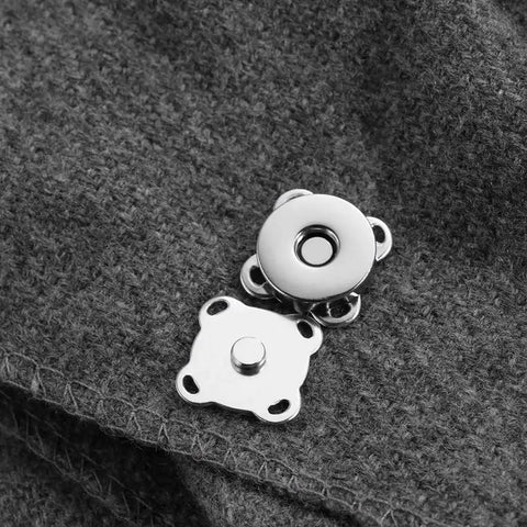 15mm silver Plum Magnetic Snap Closures for purses on gray fabric