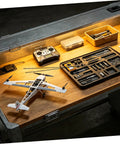RC model airplane building setup with black CF rods from 10 Pack Carbon Fiber Round Rods For RC Models, tools displayed