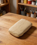 Heavy Duty Waterproof Sealing Putty Plugs Sneaky Wall Holes And Pipe Gaps With Fast Self Curing Adhesive on wooden table.