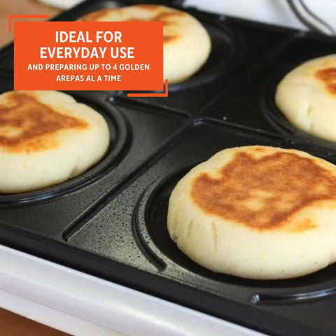 Imusa 4 Slot Electric Arepa Maker cooking four golden corn cakes on durable cast aluminum plates.