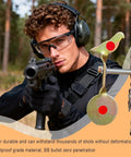 Man aiming rifle at heavy duty 3 pack spinning shooting targets for BB guns and air rifles with auto reset 360 degree spin bird target