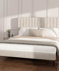 Super Soft King Velvet Bed Frame With Channel Tufted Headboard In Classic Beige for a modern bedroom with pillows and bedding.