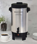 42-Cup Coffee Urn With Automatic Temperature Control on kitchen counter, silver with black handles and faucet.