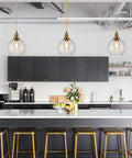 Modern Brass Seeded Glass Pendant Light With Dimmable Hanging Fixture in kitchen over island with bar stools