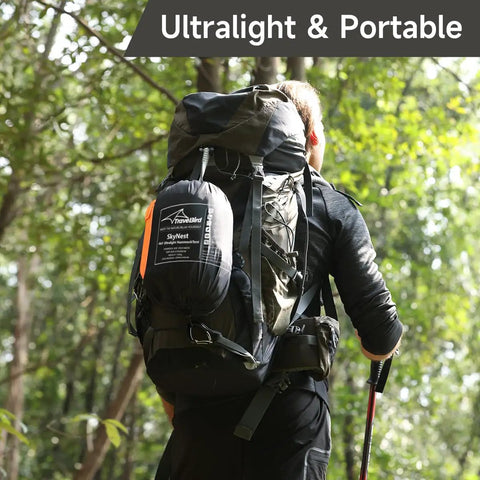 Hiker with backpack carrying UltraLight 11 Ft Hammock Shelter With Net And Rain Fly Tarp Four In One Camping Tent
