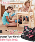 Two women assembling furniture with a pink 39 Piece Household Tool Set For Home, Garage, Office And Dorm, with tools shown in foreground.