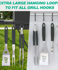HAUSHOF stainless steel BBQ utensil set with spatula, fork and tongs hanging on a rack; split outdoor and indoor display