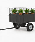 Heavy Duty Steel ATV UTV Dump Trailer With 750 Lb Capacity, 17 Cu Ft Tow Behind Utility Cart holding potted plants