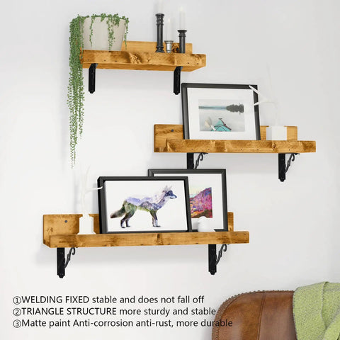 Heavy Duty Decorative Shelf Brackets 5 By 3.5 Inch Matte Black Metal Corner Supports Two Hundred Pounds Built Like A Tank Rust Proof Wall Mount Hardware For Easy Home Organization Two Pack on wooden shelves holding artwork.