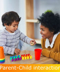 Child using Super Cool Rainbow Counting Bears Set Sixty Bright Plastic Bears And Matching Sorting Cups to learn math with parent.