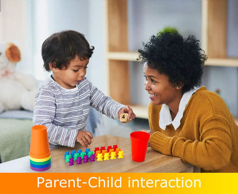 Child using Super Cool Rainbow Counting Bears Set Sixty Bright Plastic Bears And Matching Sorting Cups to learn math with parent.