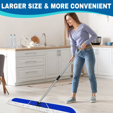 Pro Level Commercial Dust Mop Featuring A Telescopic Stainless Handle And Hella Absorbent Blue Cotton Pad For Quick Floor Sweep and Tight Dust Removal On Hardwood Floors Today in use in a kitchen.