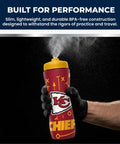 Hand holding NFL Football Squeeze Bottle 32 Ounce Hydration Bottle For Sports Kids And Adults Easy Squeeze Design Kansas City Chiefs