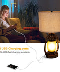 Set Of 2 Farmhouse Table Lamps With Dual USB Charging Ports And 4 Way Rotary Switch shown with phone charging on sofa
