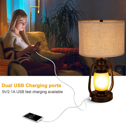 Set Of 2 Farmhouse Table Lamps With Dual USB Charging Ports And 4 Way Rotary Switch shown with phone charging on sofa
