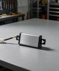 Heavy Duty DC Voltage Step Down Converter Swaps 36V Or 72V Straight To 12V with plug connector on gray surface.