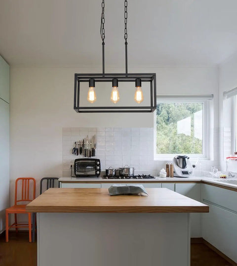 Three Light Black Linear Chandelier for Modern Dining Room and Kitchen Island Bar Rectangle Farmhouse Pendant Light Industrial Style Fixture with UL Listed hanging above a kitchen island in a bright room