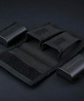 Durable Camera Battery Pouch Case For 2 Batteries With Zipped Card Pocket, shown open with two batteries beside it