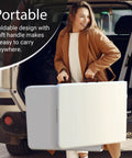 Woman carrying 6 foot foldable table with built in handle and steel legs, heavy duty portable utility table party ready