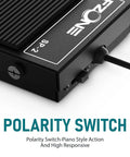 Close-up of all-metal sustain pedal showing polarity switch, labeled FZONE SP-2, black design. Compact All Metal Sustain Pedal For Keyboards Digital Pianos Synthesizers Tone Modules And Drum Machines With Quarter Inch Jack, Heavy Duty Non Slip Base, Polarity Switch, Built For Durability And Rock Solid Performance.