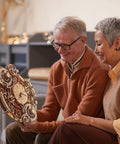 Couple admiring a Dope 3D Wooden Puzzle Clock Kit For Adults Hands On Zodiac Wall Clock Project Build Your Own Retro Steampunk Wood Model Kit With Quiet Movement And Date Dial.