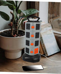 Heavy Duty Usb Power Strip With Secure Outlet Protectors Multi Port Smart Charger Fireproof Build in grey color beside a plant.