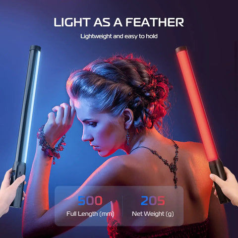 Model using Handheld Light Wand With 360 Degree RGB LED Video Light Stick For Photography And Vlogging in a studio setup