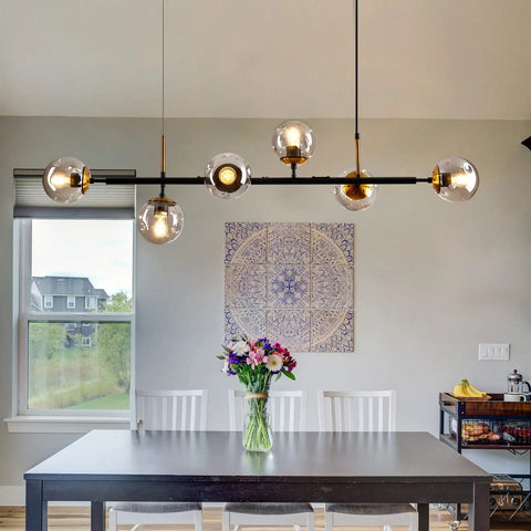 Mid-Century Glass Globe Pendant Light Fixture In Black And Gold over dining table