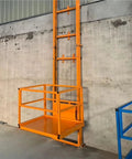 Hassle Free Compact Small Cargo Elevator Makes Heavy Freight Moves Look Easy Space Saving Interfloor Lift with bright orange frame.