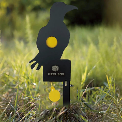 Auto Reset Metal Eagle Target For Air Rifles Outdoor Backyard Plinking Practice For 177 And 22 Caliber Pellets visible in grass